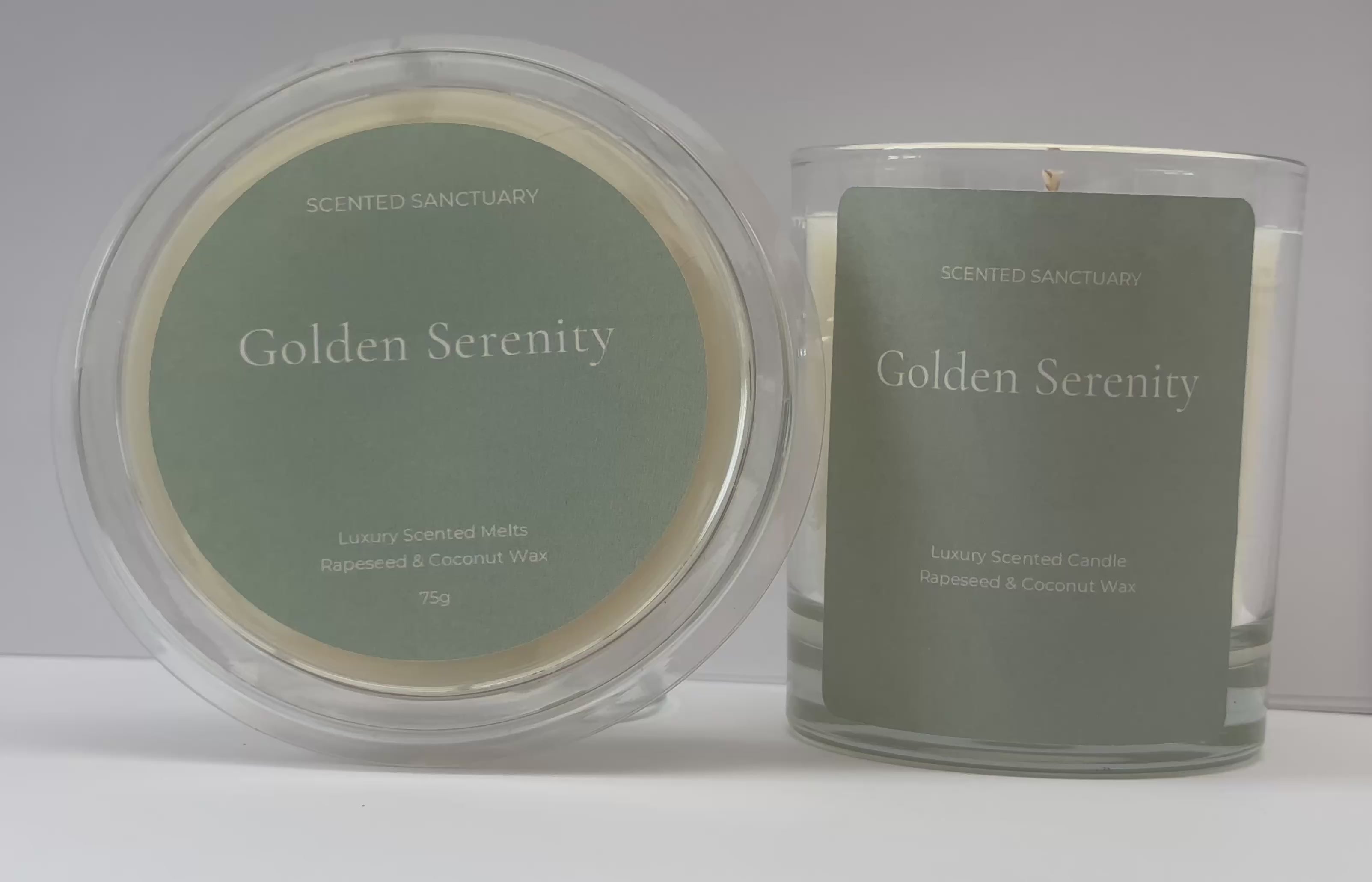 Product showcase video of the Golden Serenity range: a clear 75g wax melt clamshell and a 220g clear glass candle, both featuring minimalist sage green labels with white text. Audio voiceover details the fresh lemongrass, ginger, cedar, and patchouli fragrance notes