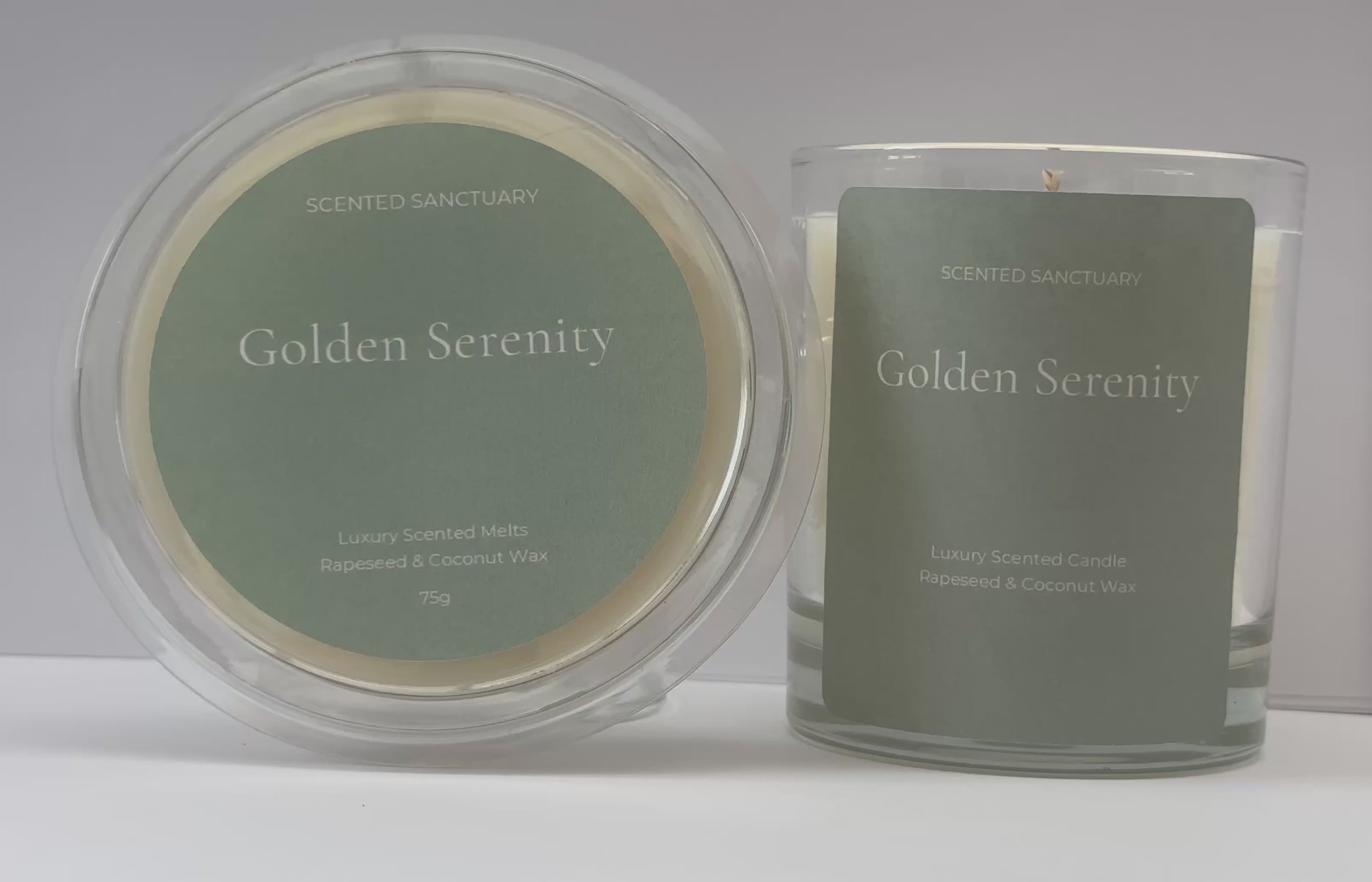 Product showcase video of the Golden Serenity range: a clear 75g wax melt clamshell and a 220g clear glass candle, both featuring minimalist sage green labels with white text. Audio voiceover details the fresh lemongrass, ginger, cedar, and patchouli fragrance notes